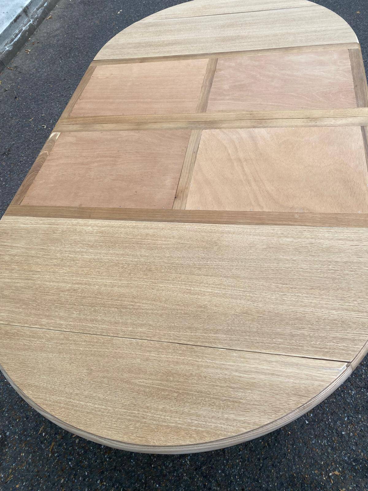 Round dining table with extendable leaves, Louis Philippe style, stripped in raw oak.