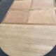 Round dining table with extendable leaves, Louis Philippe style, stripped in raw oak.