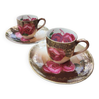 Duo of fine porcelain cups and saucers decorated with Roses