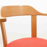 Chair upholstered in red and beech