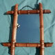 Old wooden mirror, carved bamboo way