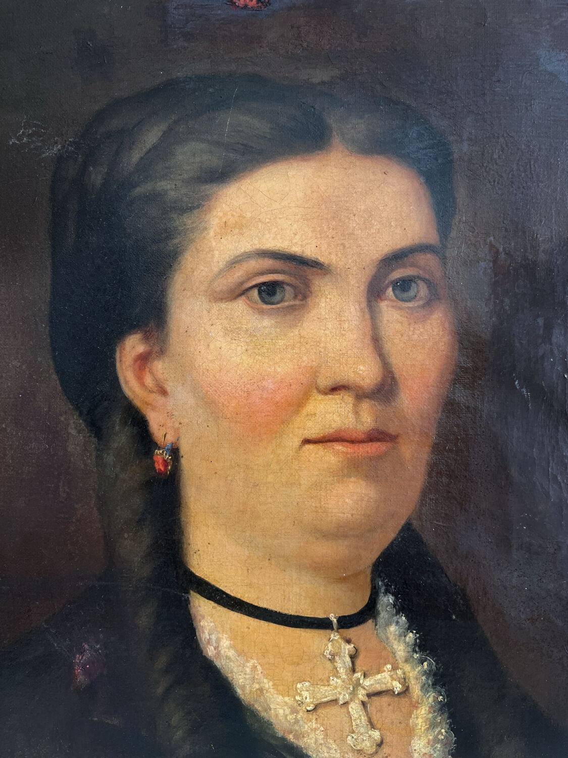 Old oil painting on canvas portrait of a woman with a red bow, late 19th century