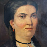 Old oil painting on canvas portrait of a woman with a red bow, late 19th century