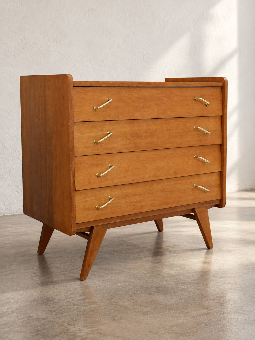 Vintage 1960s commode with tapered legs.