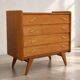 Vintage 1960s commode with tapered legs.
