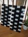 "Pair of GYLLEN wall lights – IKEA – black and white check pattern – graphic design"
