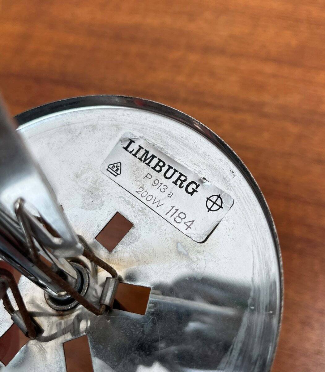 Minimalist suspended glass ball lamp from the vintage German space age by Glashütte Limburg, 1970s.