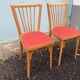 2 red Baumann bistro chairs