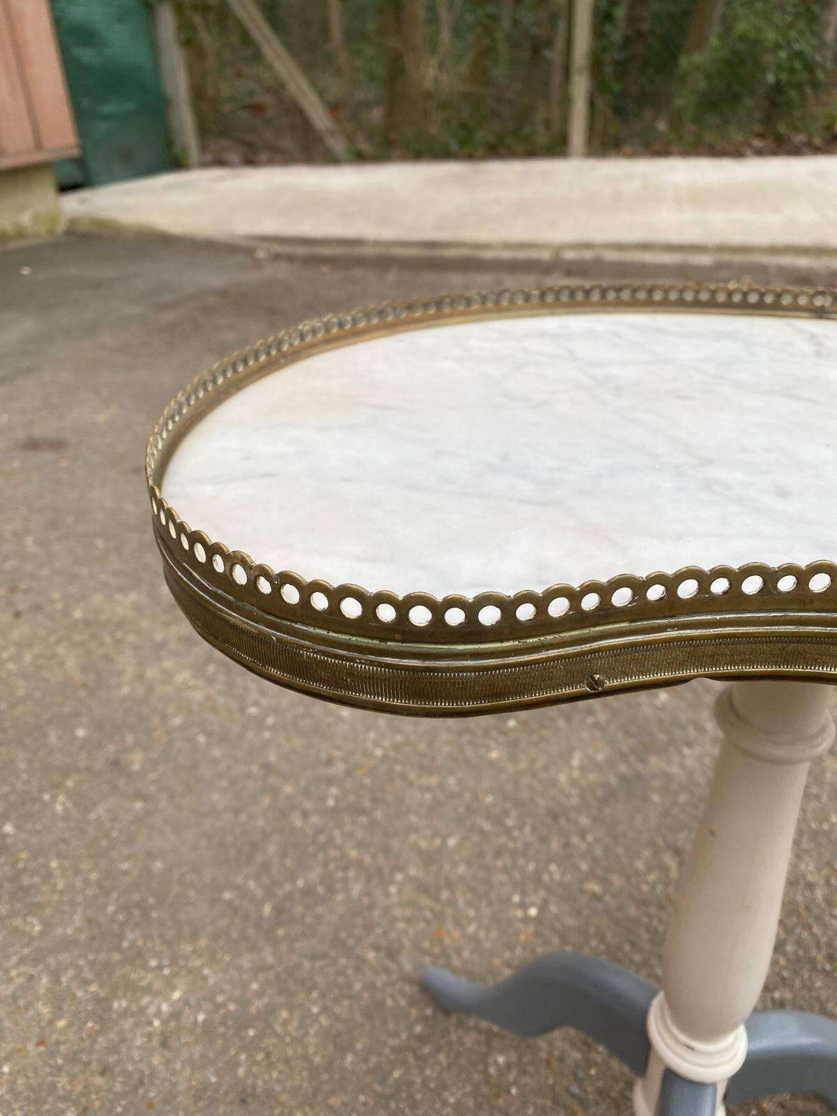 Pair of marble and ivory tripod pedestal tables
