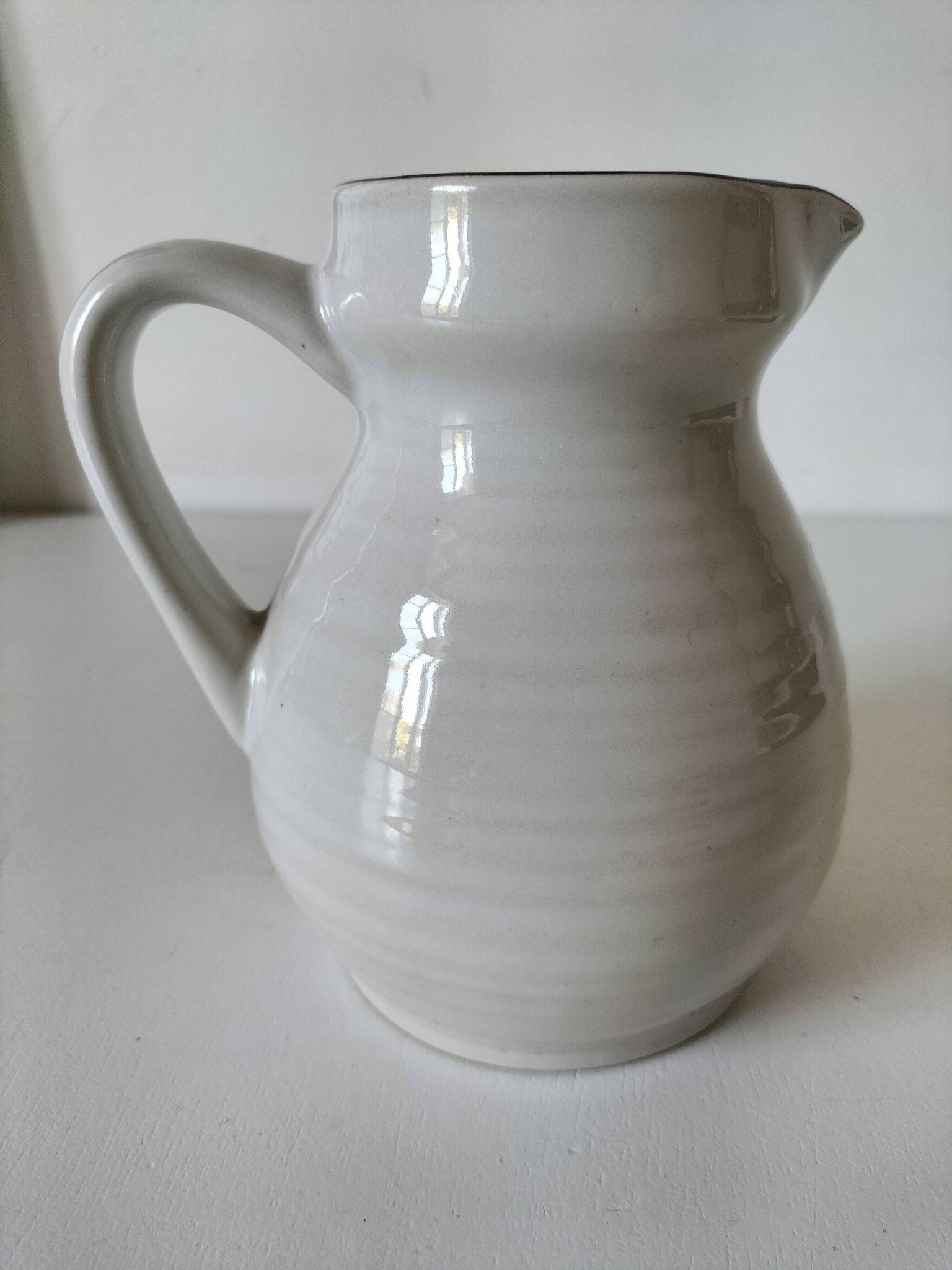 Ceramic pitcher from Quimper, created by Dominique Villard.