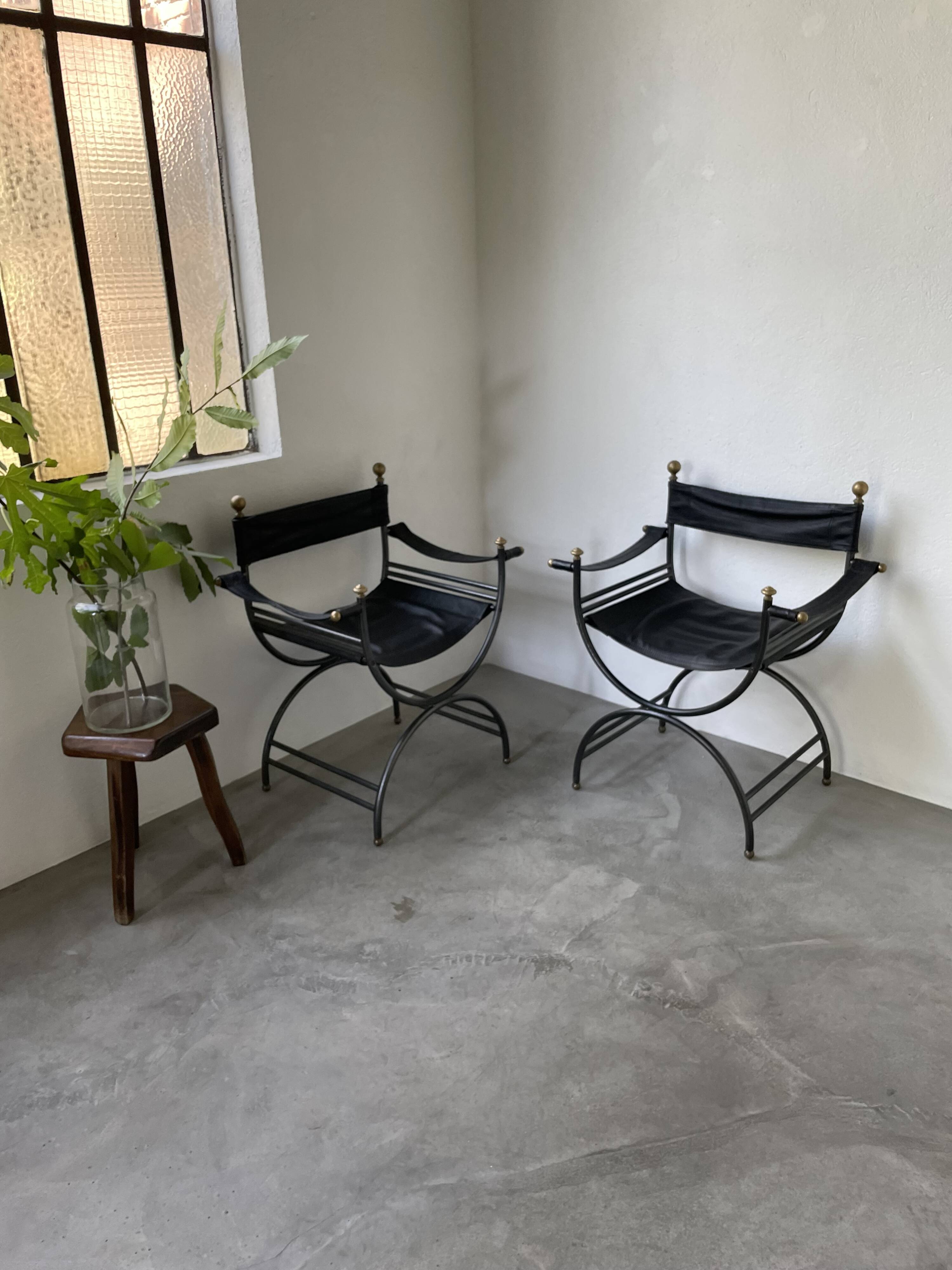 Pair of leather “curule” emperor armchairs