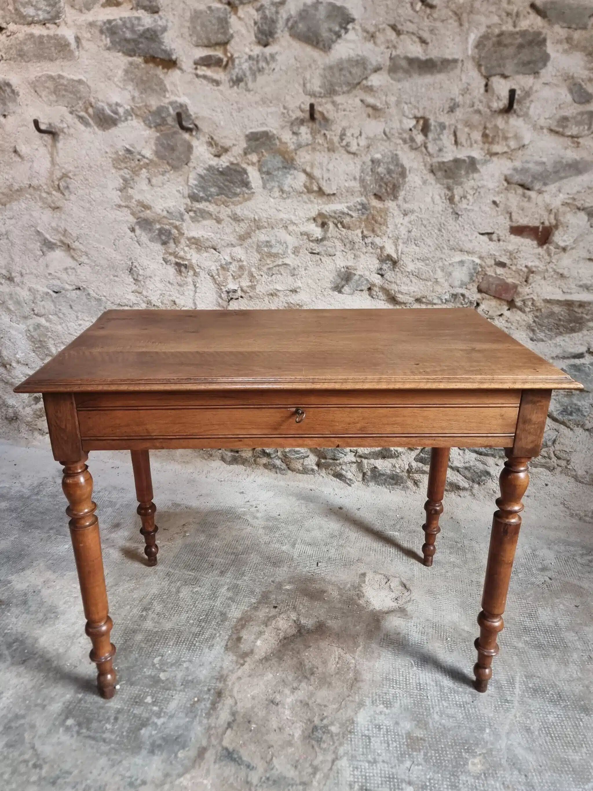 Antique French writing table in walnut with a drawer, circa 1900.