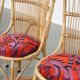 Set of 4 subtle and charming vintage 60s rattan boho chairs with colorful upholstered seats