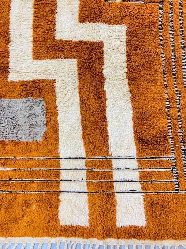 Modern Moroccan rug in rust wool with cream lines 150/250 cm