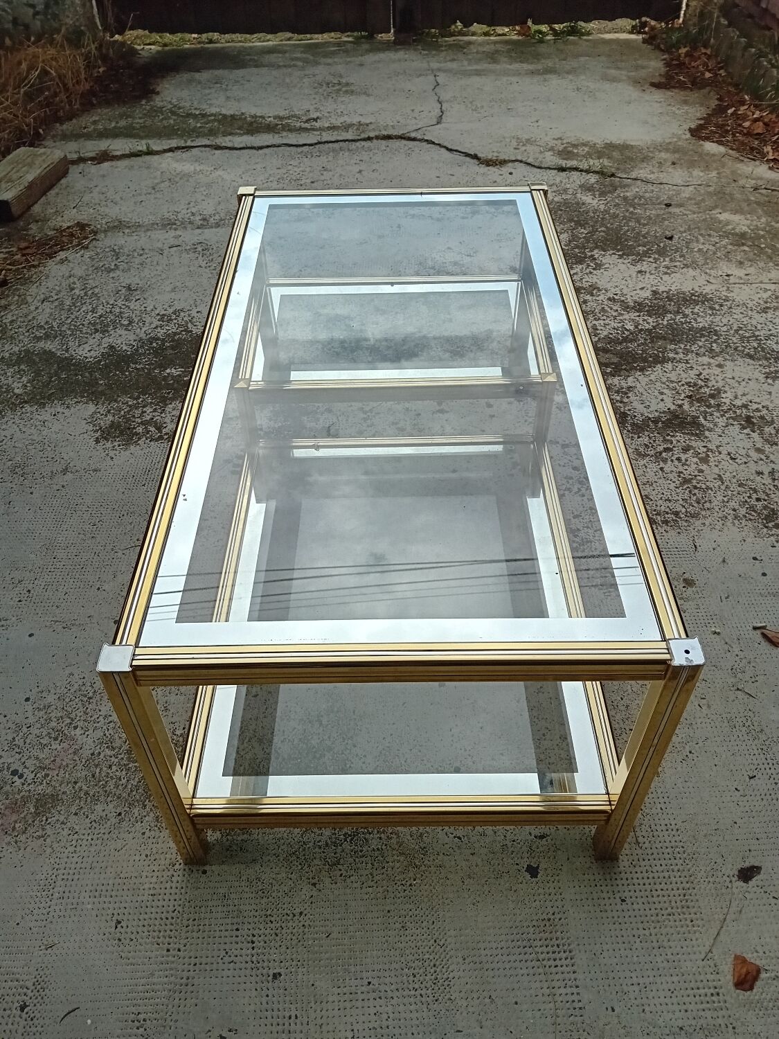 Glass and golden brass coffee table