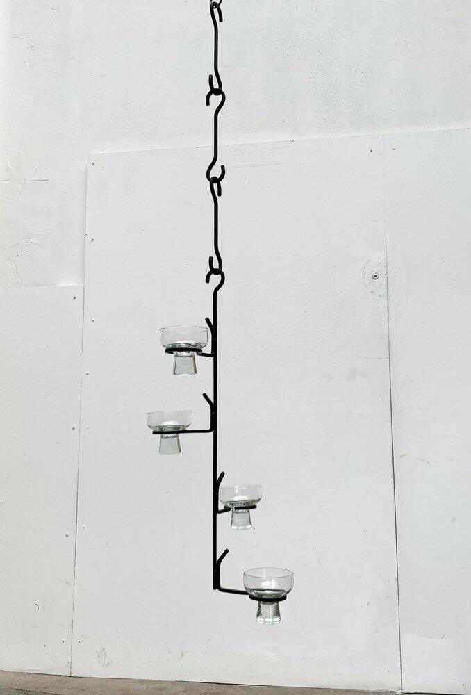 Mid-century metal and glass pendant light from the 1960s.