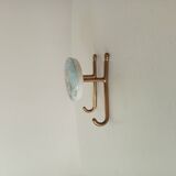 Vintage wall coat hook in brass and Bakelite.