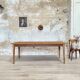 Vintage farm table with spindle legs.