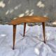 Vintage Scandinavian bean side table with wooden tapered legs.