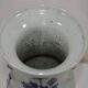 China. Porcelain mallet vase with blue and white phoenix decoration on a rock.