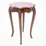 Table with a marble top, France, around 1910.