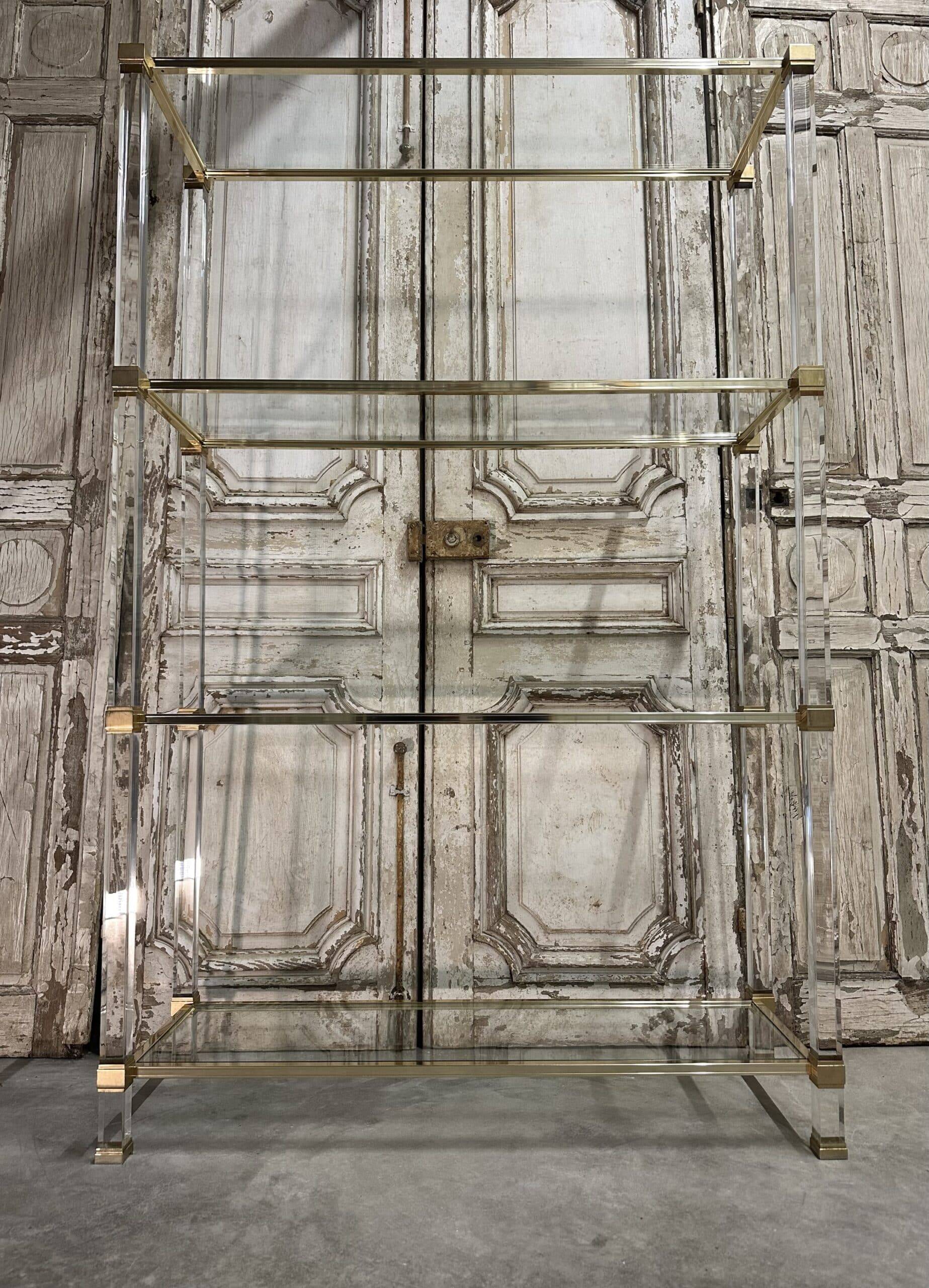 Plexiglass shelf by Pierre Vandel in Hollywood Regency style circa 1970.