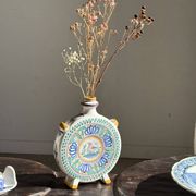 Vintage flat plate in white Modra earthenware, hand-painted.