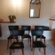 5 chairs in wood and black faux leather, Scandinavian style