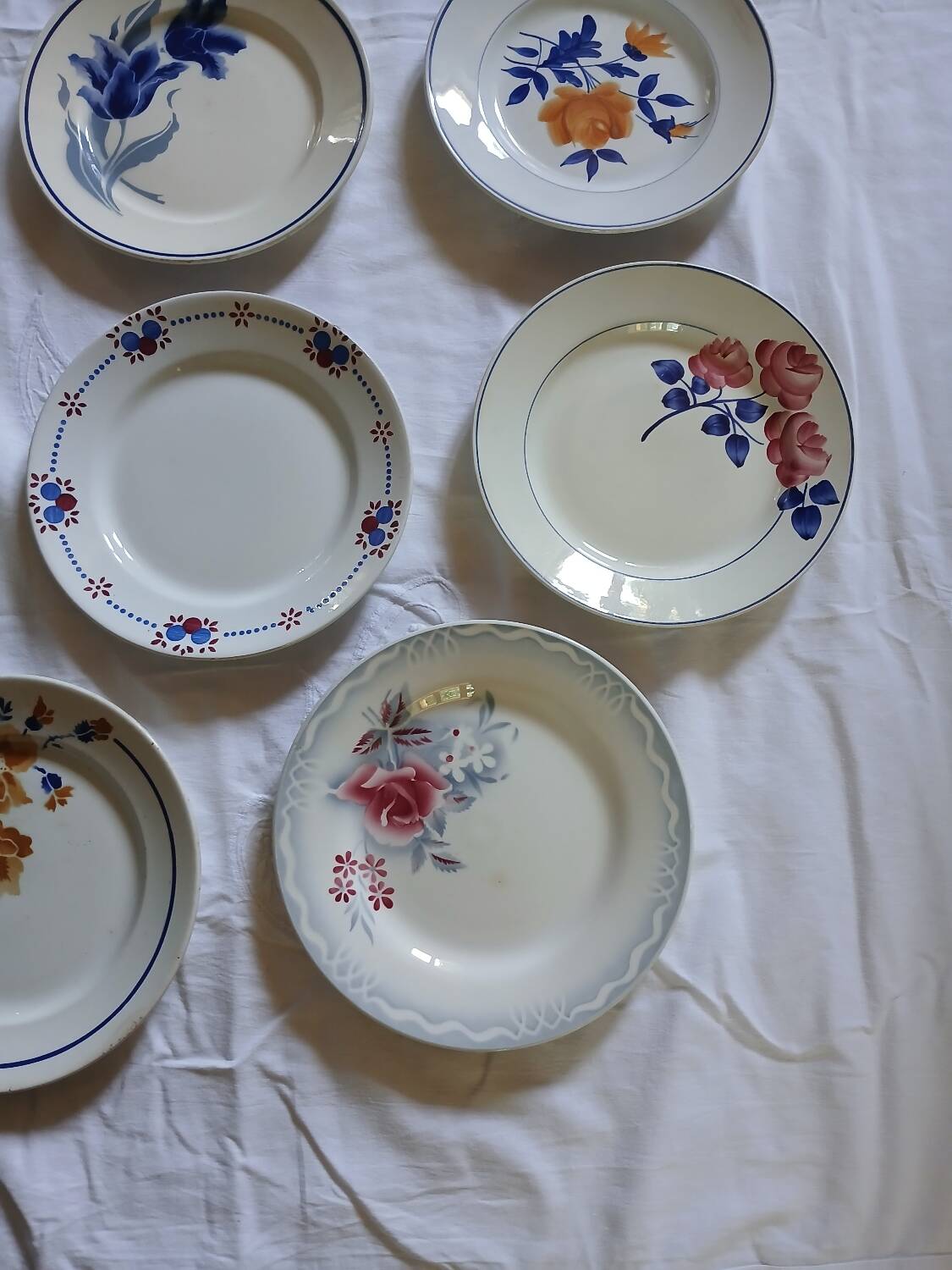 14 mismatched antique dinner plates
