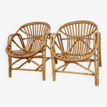 pair of Coquille rattan armchairs