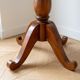 Empire style gueridon in solid wood and green leather.