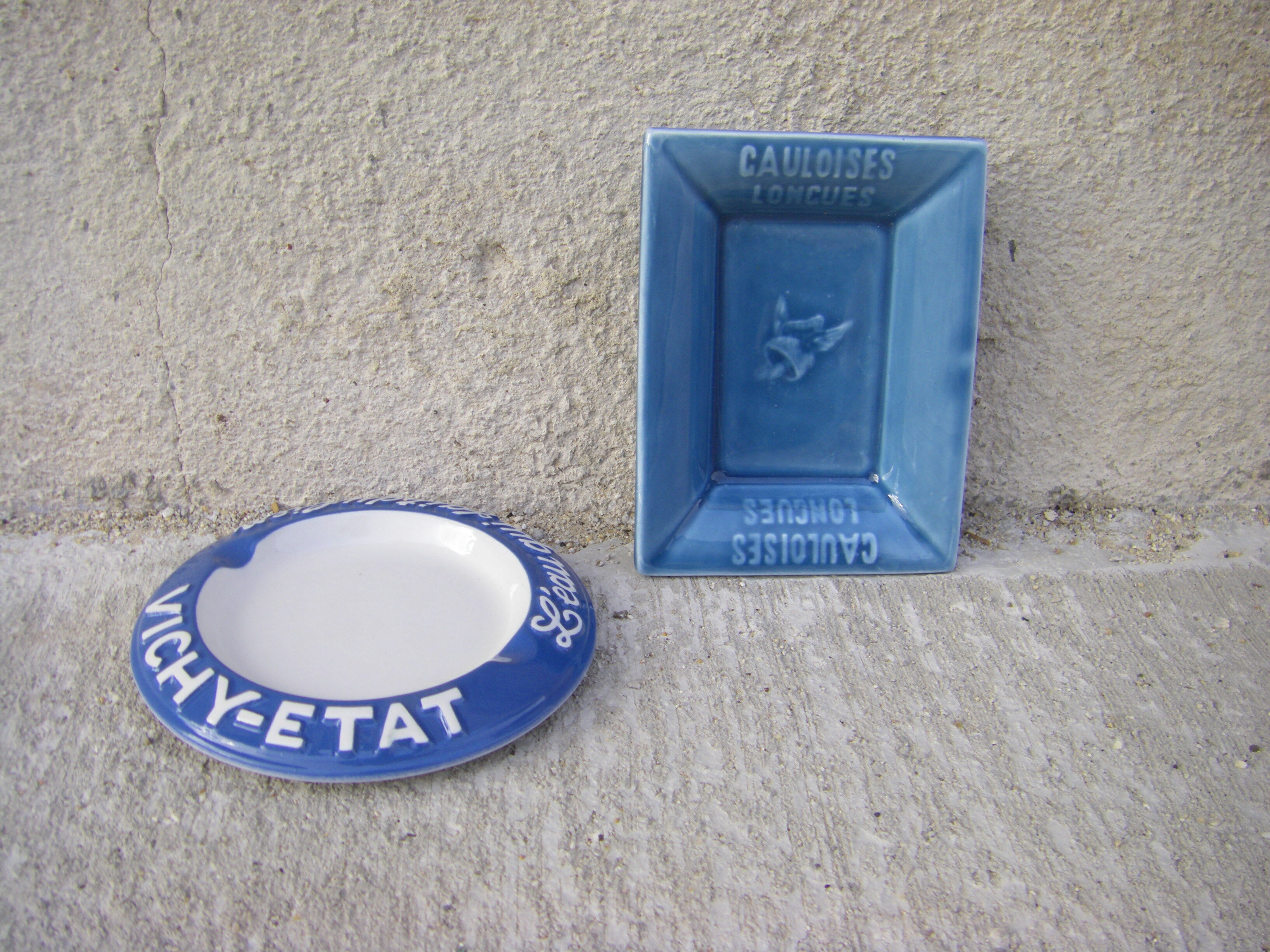 Two advertising ashtrays