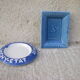 Two advertising ashtrays
