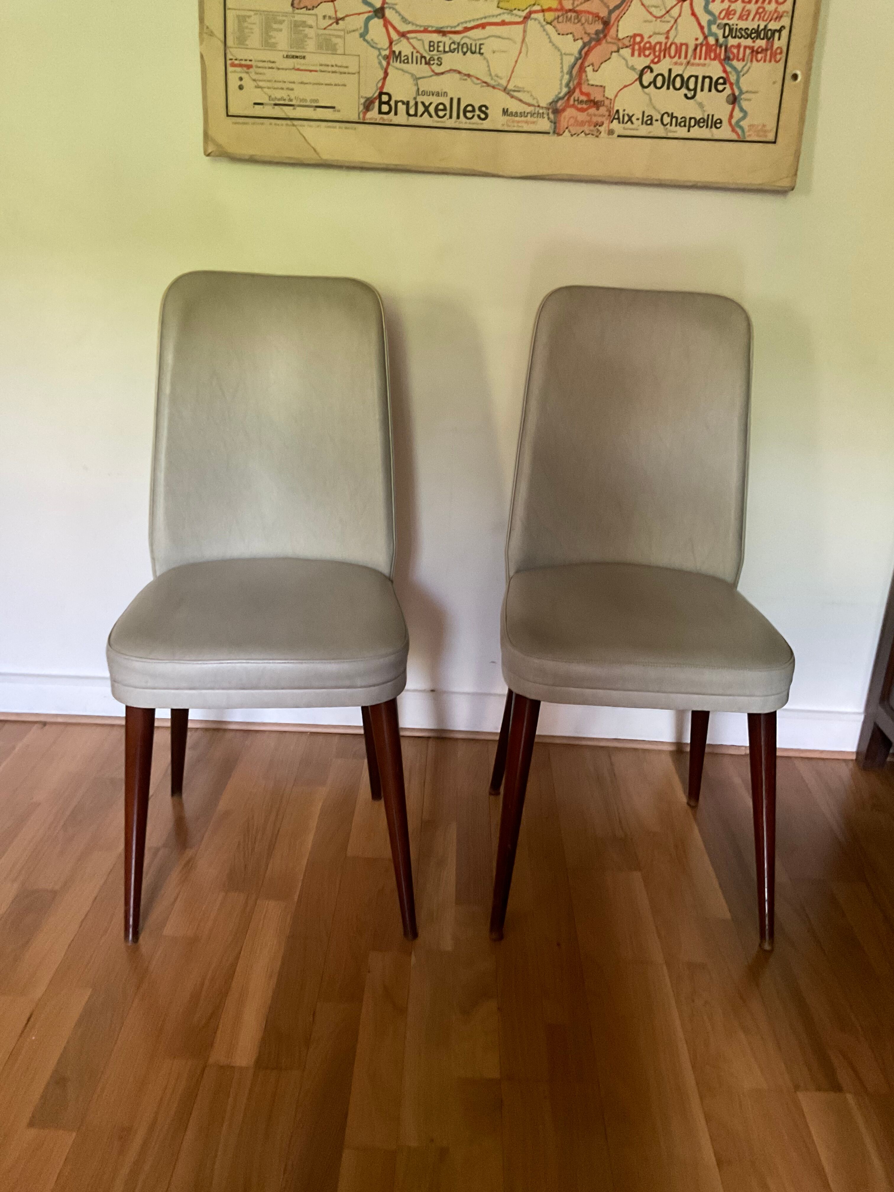 Pair of vintage mahogany and skai chairs