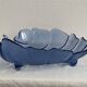 Large leaf-shaped fruit bowl, made of moulded blue glass.