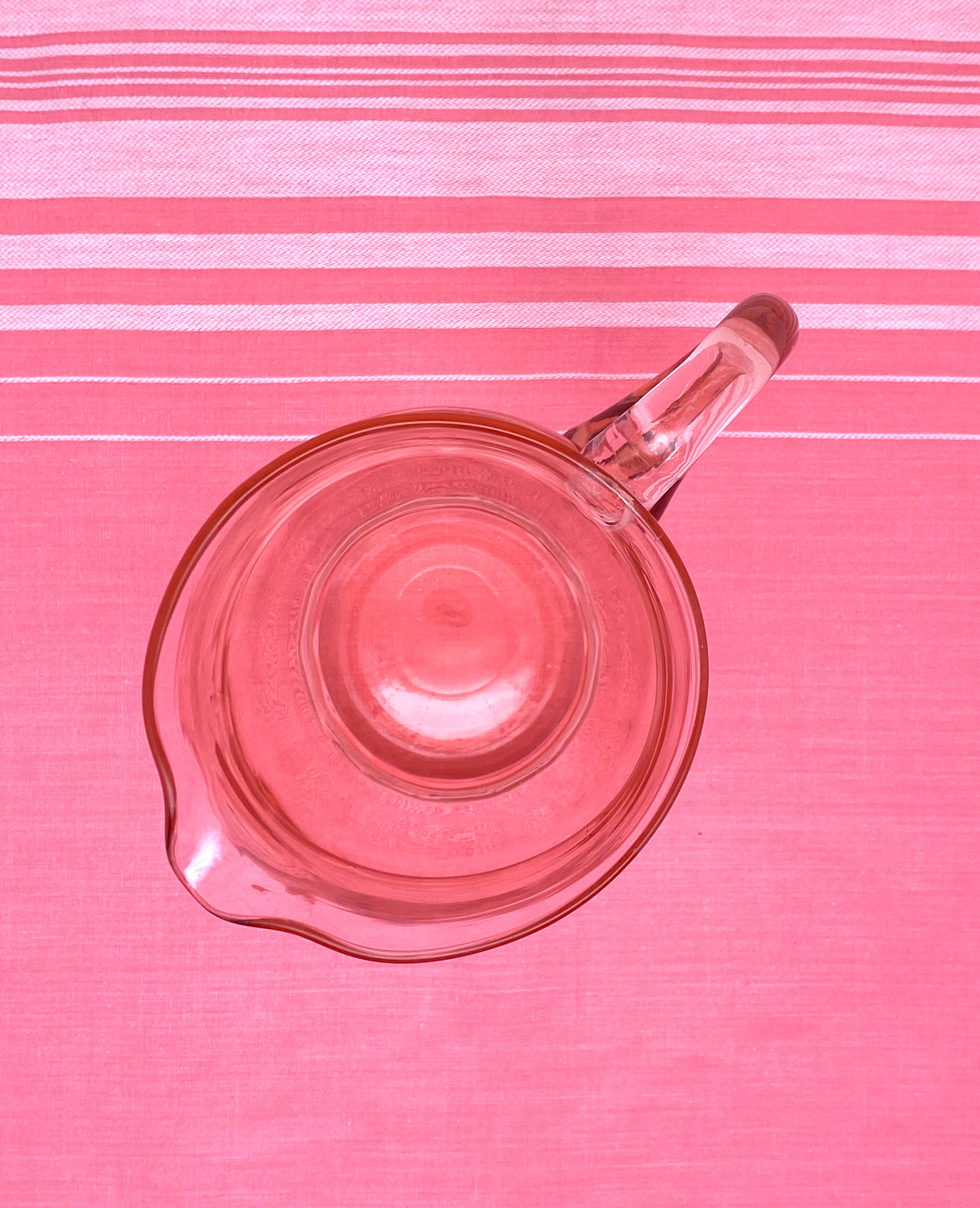 Rounded pink glass decanter
