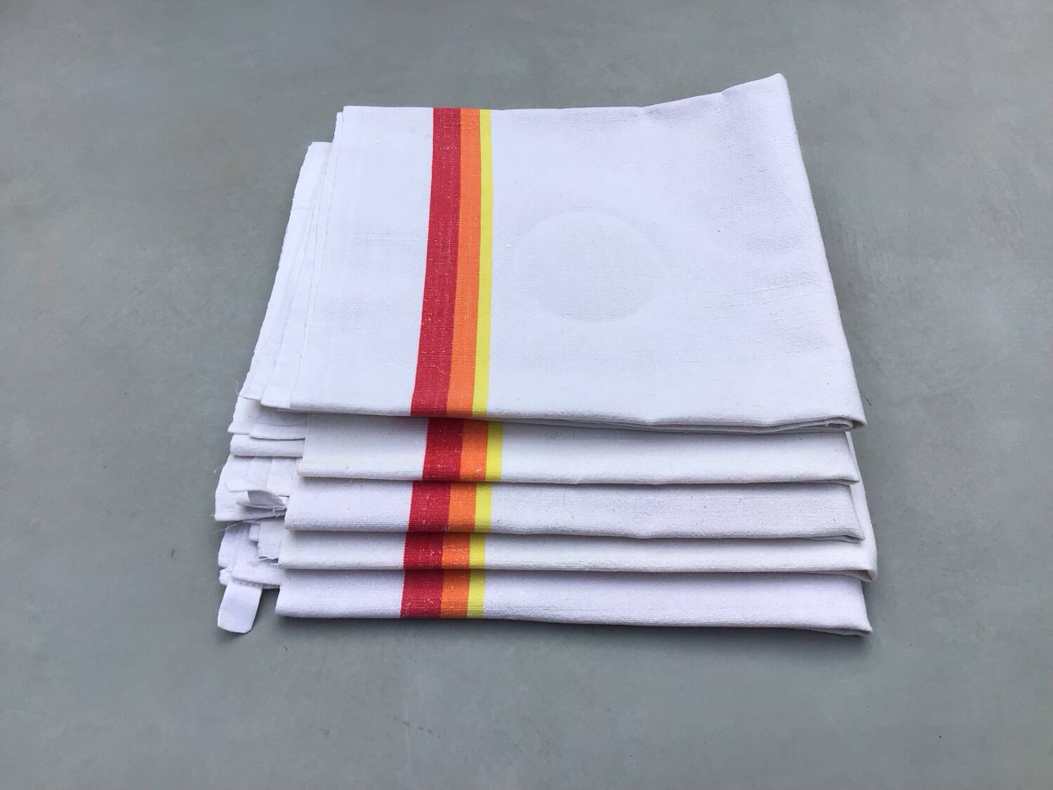 5 old tea towels in ecru linen with orange, red and yellow stripes