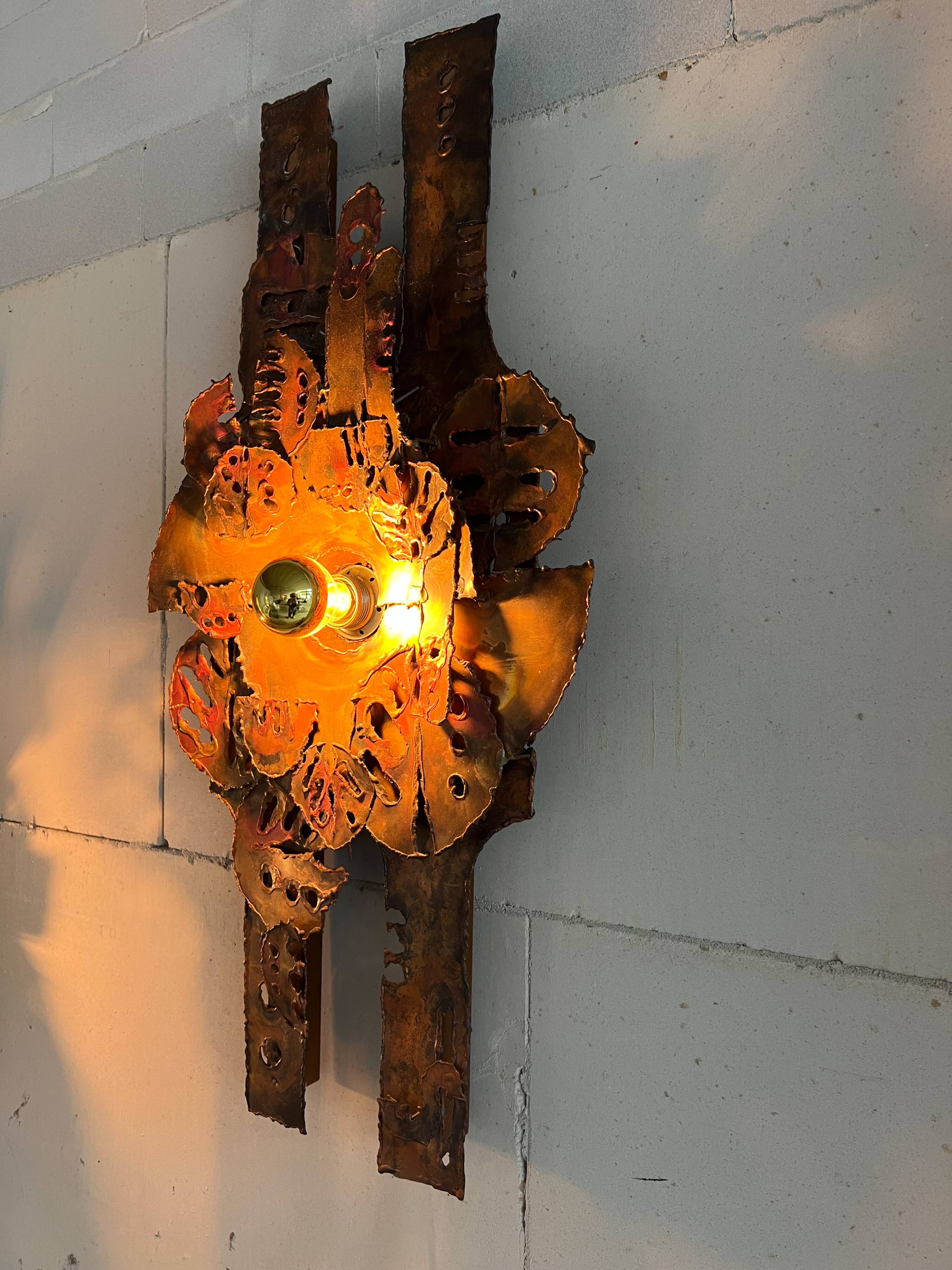 Raw expressive wall sconces by Francesco Pasinato