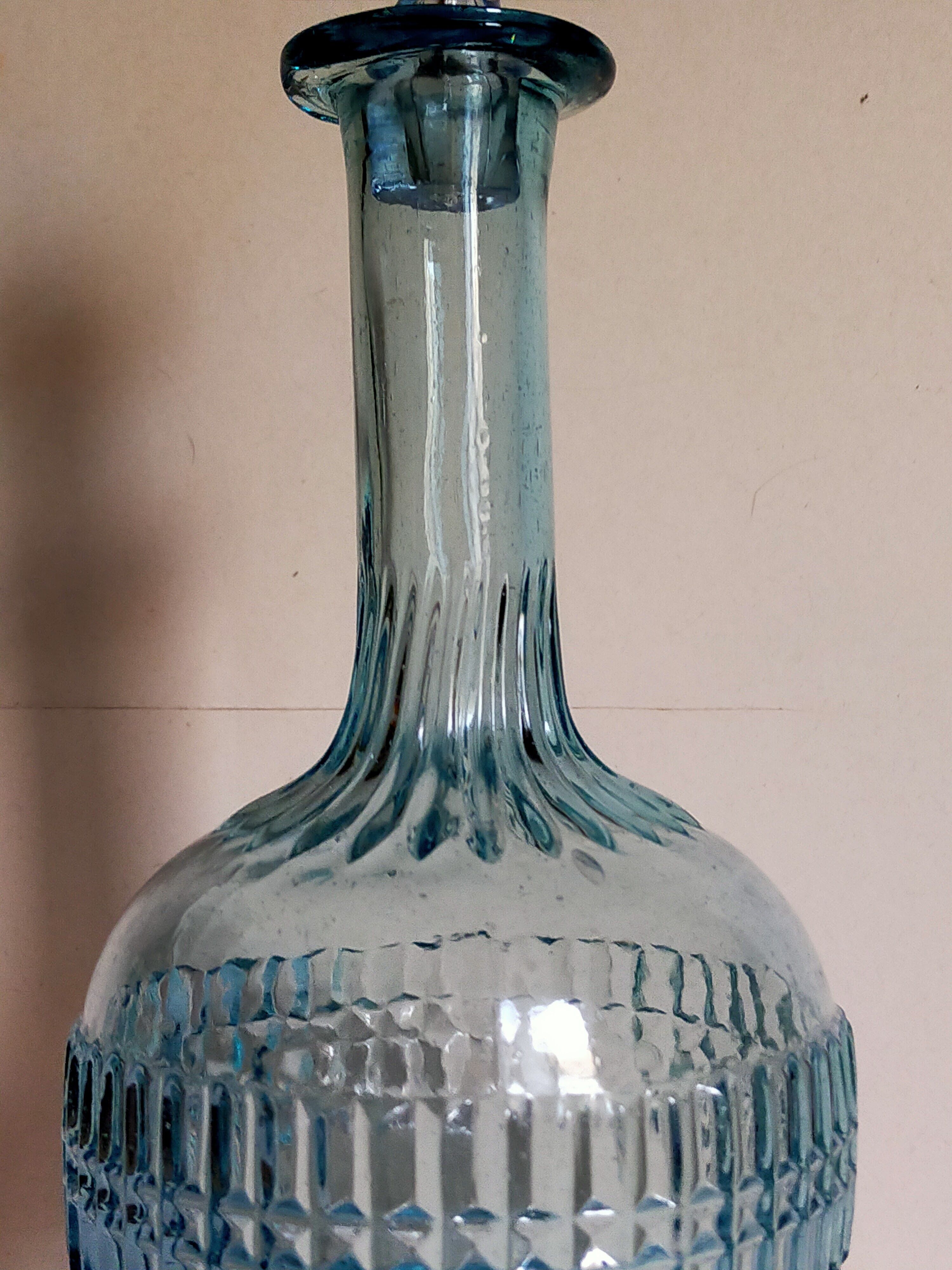 Blue glass carafe with vintage pegs