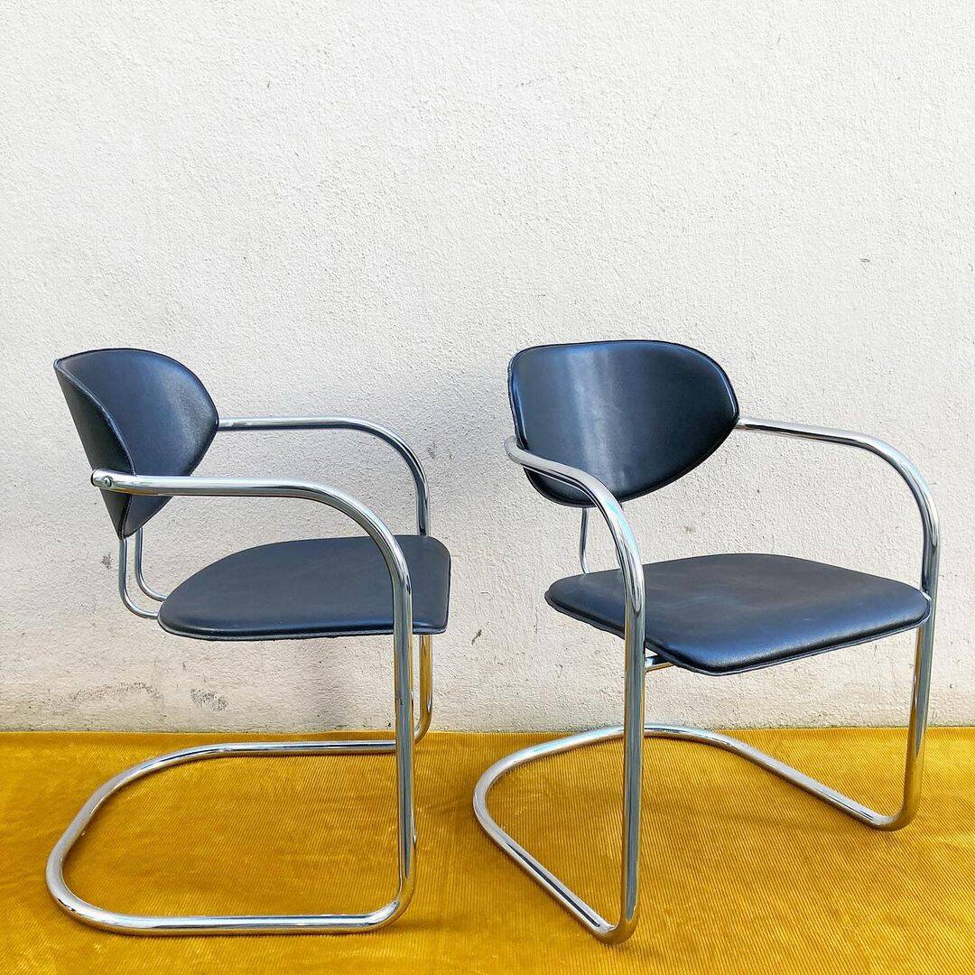 Pair of Effezeta chairs, tubular structure, chrome and black skai