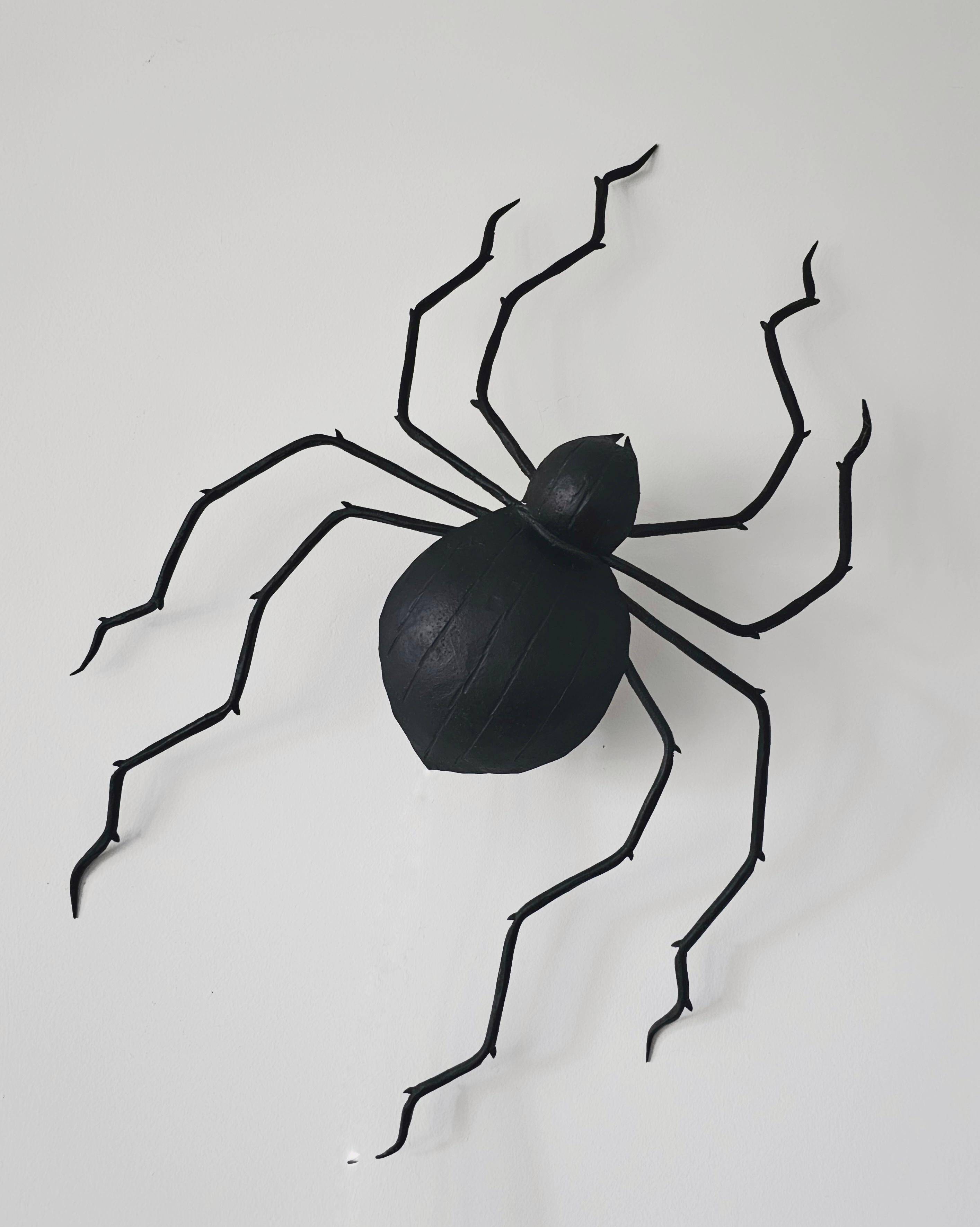 Wall lamp in iron Mid Century Modern spider style from the 1960s.