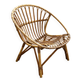 Vintage 1960s rattan shell chair – an icon of bohemian design.