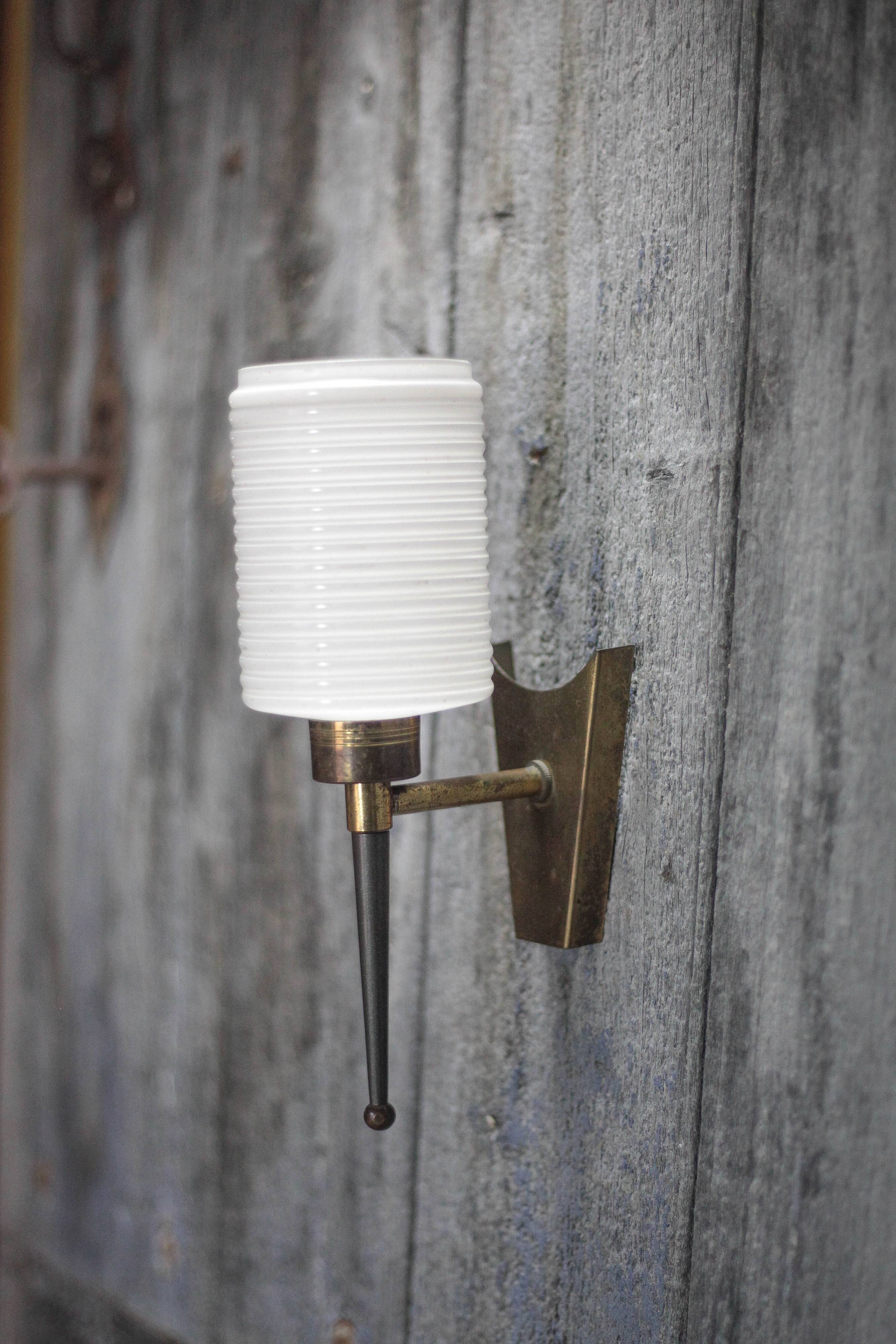 Brass wall light, black lacquered metal and white opal glass, 50s.