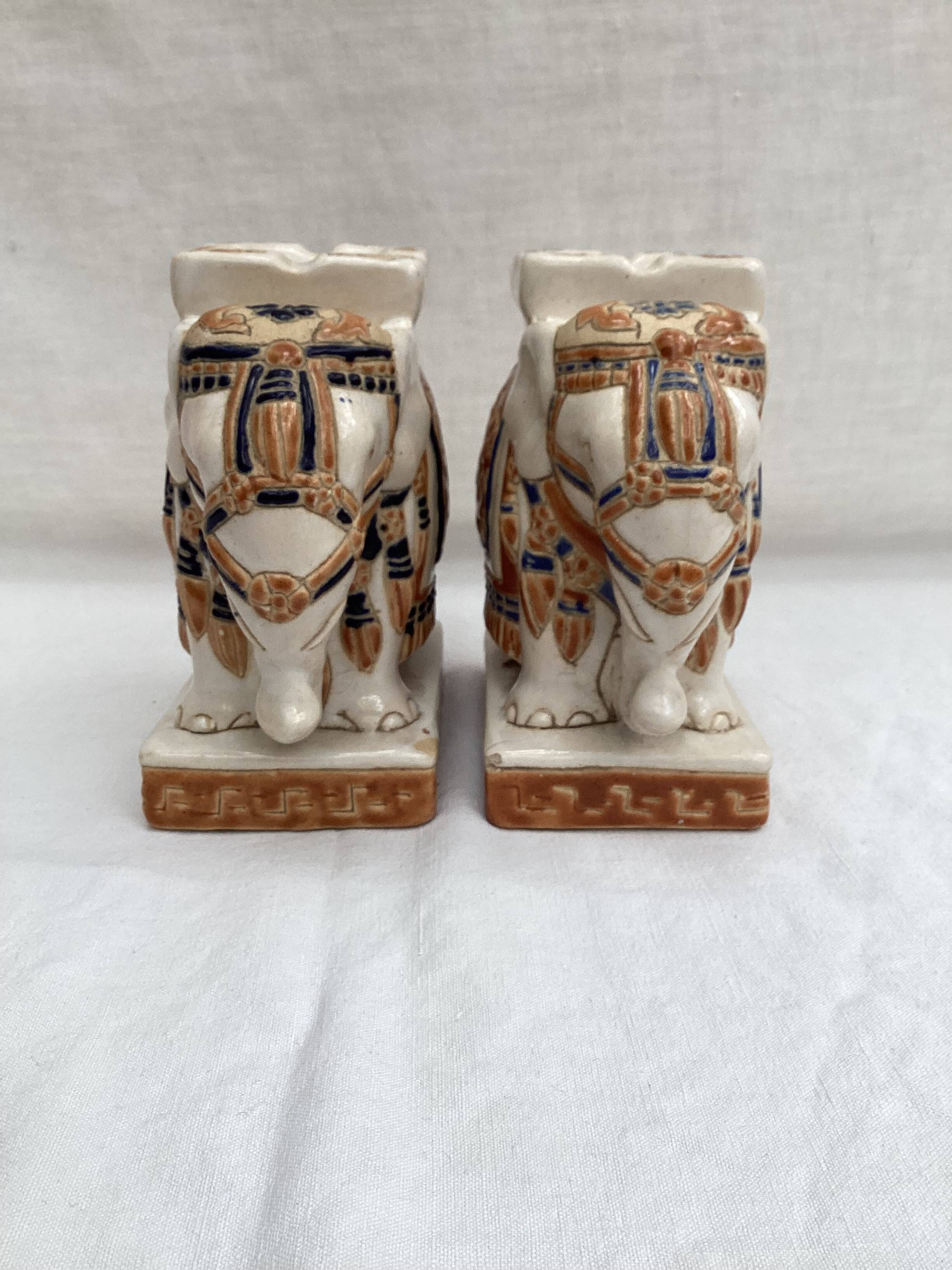 Pair of ceramic elephant ashtrays dimensions: height -14cm- width -13.5cm-