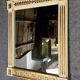 D'après Versace : miroir style Consulat en bois laqué et doré