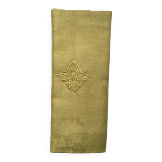 Old embroidered green square table napkin with cutwork