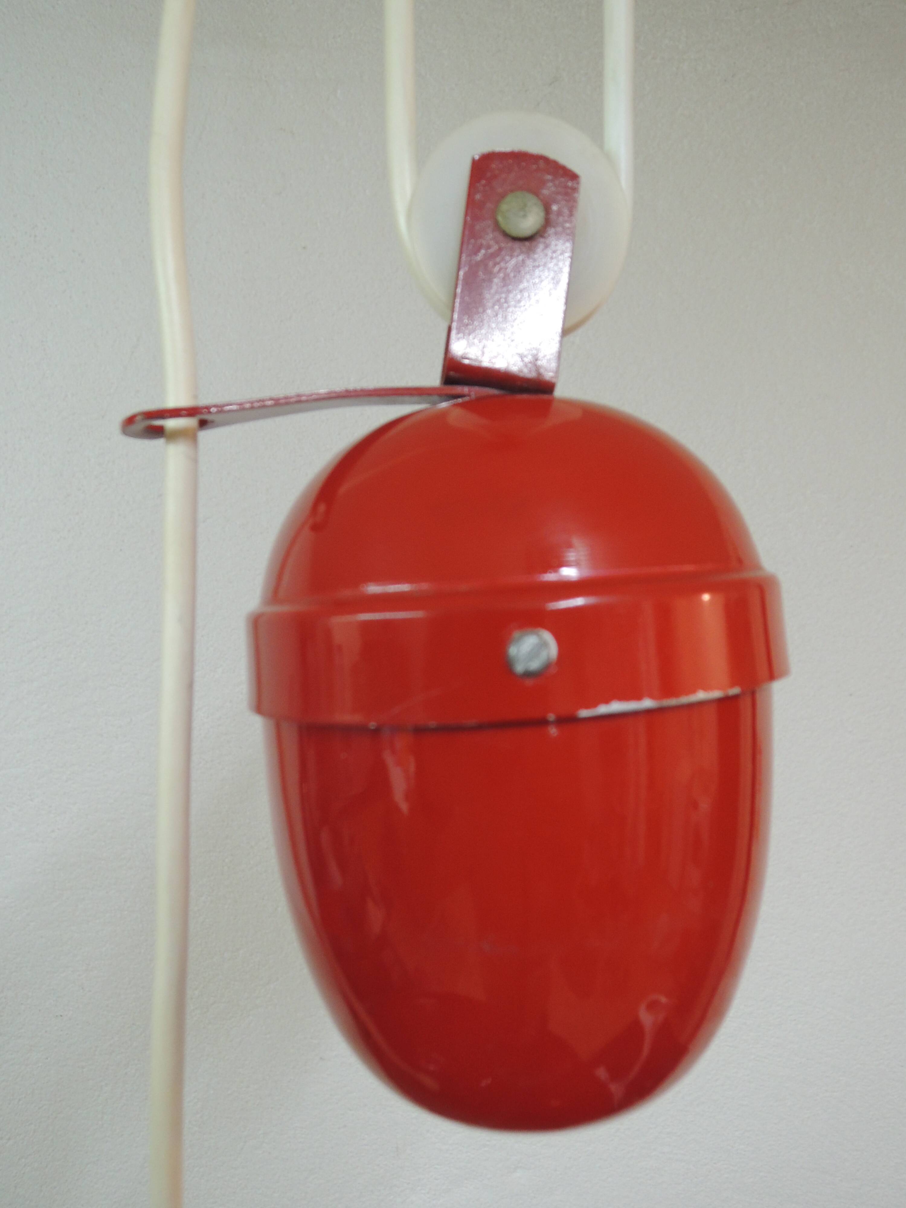 Red metal suspension rises and lowers.