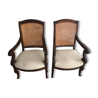 Pair of armchairs with a canned back