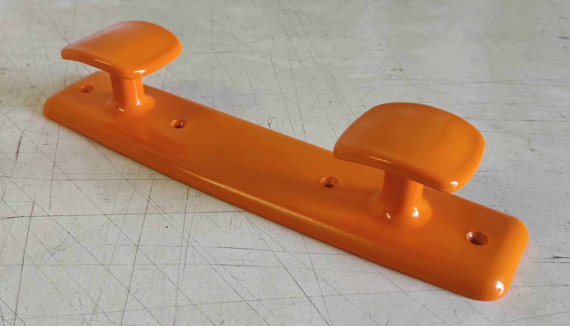 Orange plastic coat rack by Syla - 70's