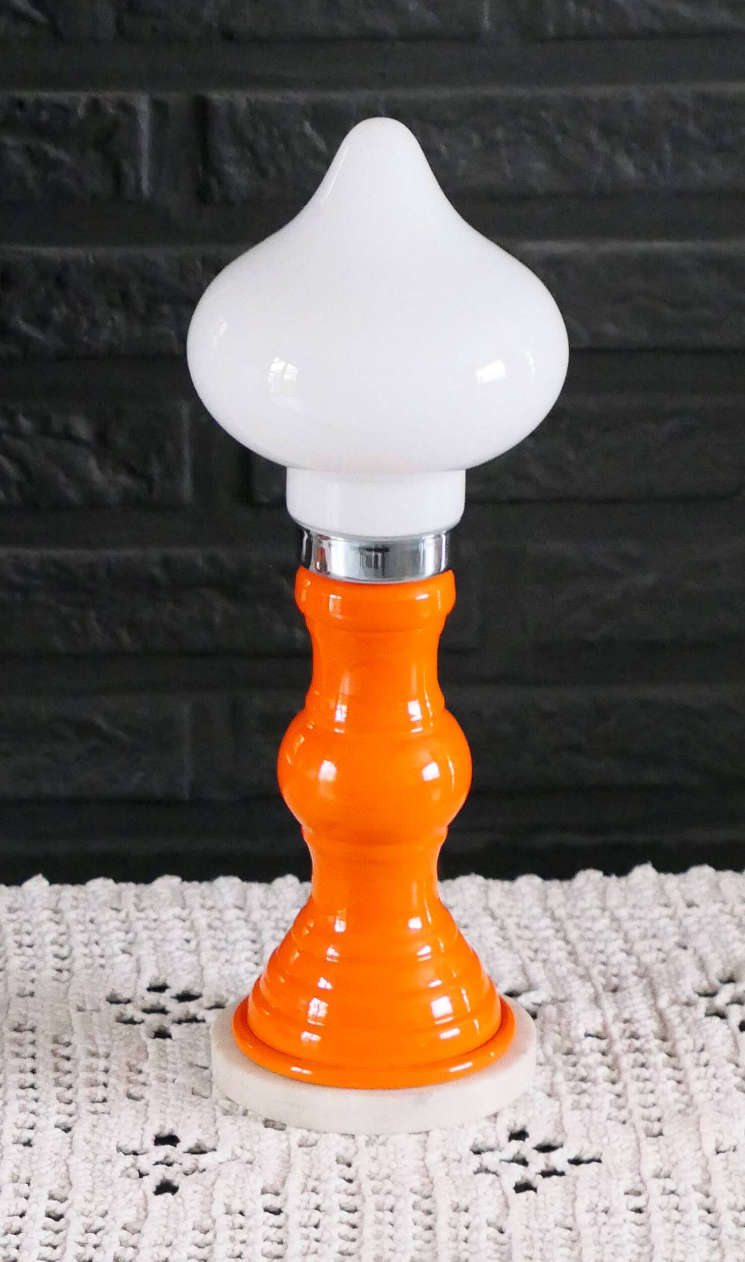 Table lamp or bedside lamp from the 1960s-70s in orange and chrome.
